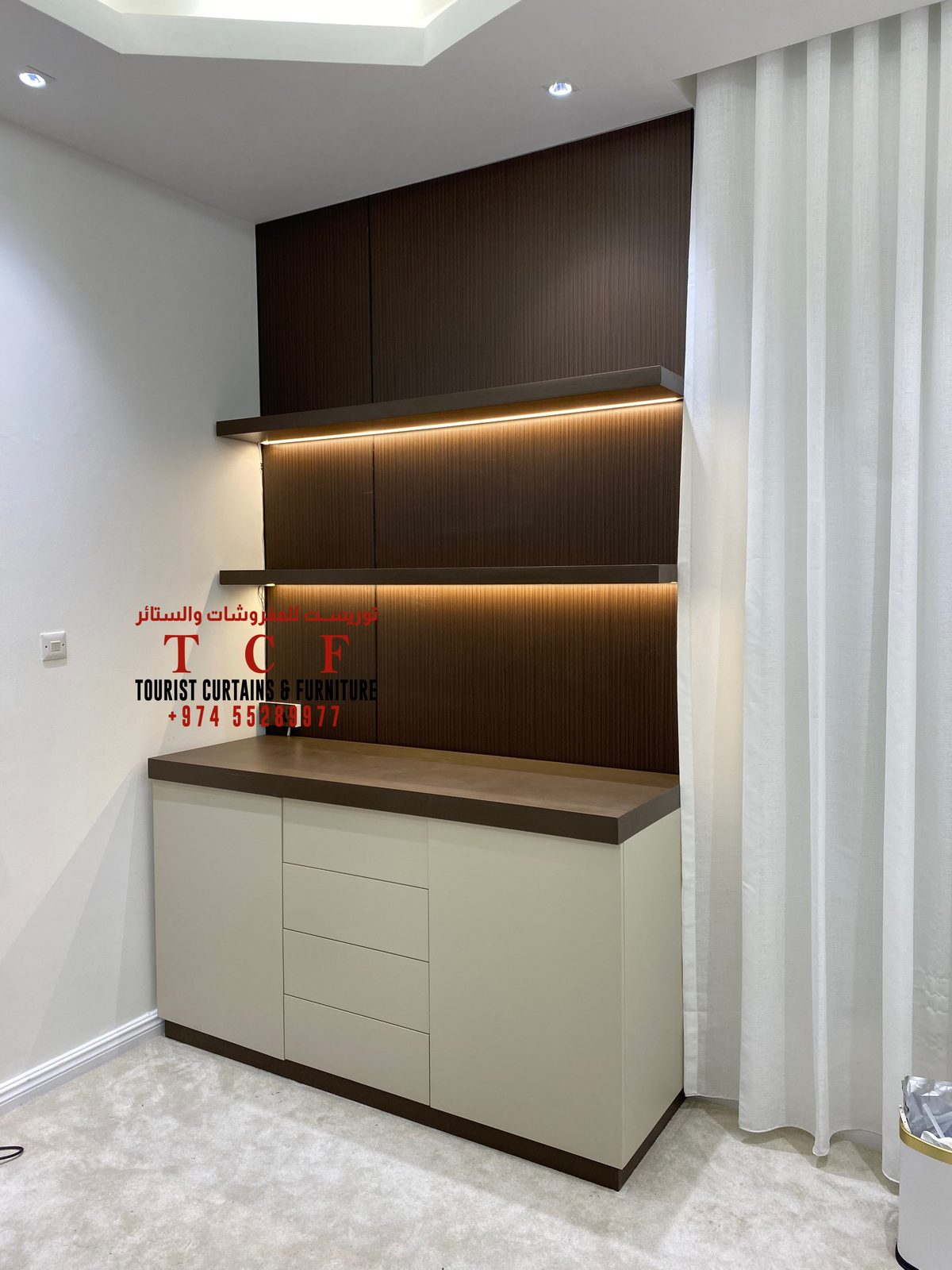Sheer curtains beside a custom cabinet